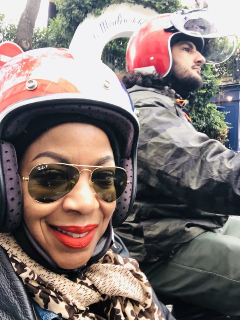 Riding in the side car of the Retro Tour Paris with helmets